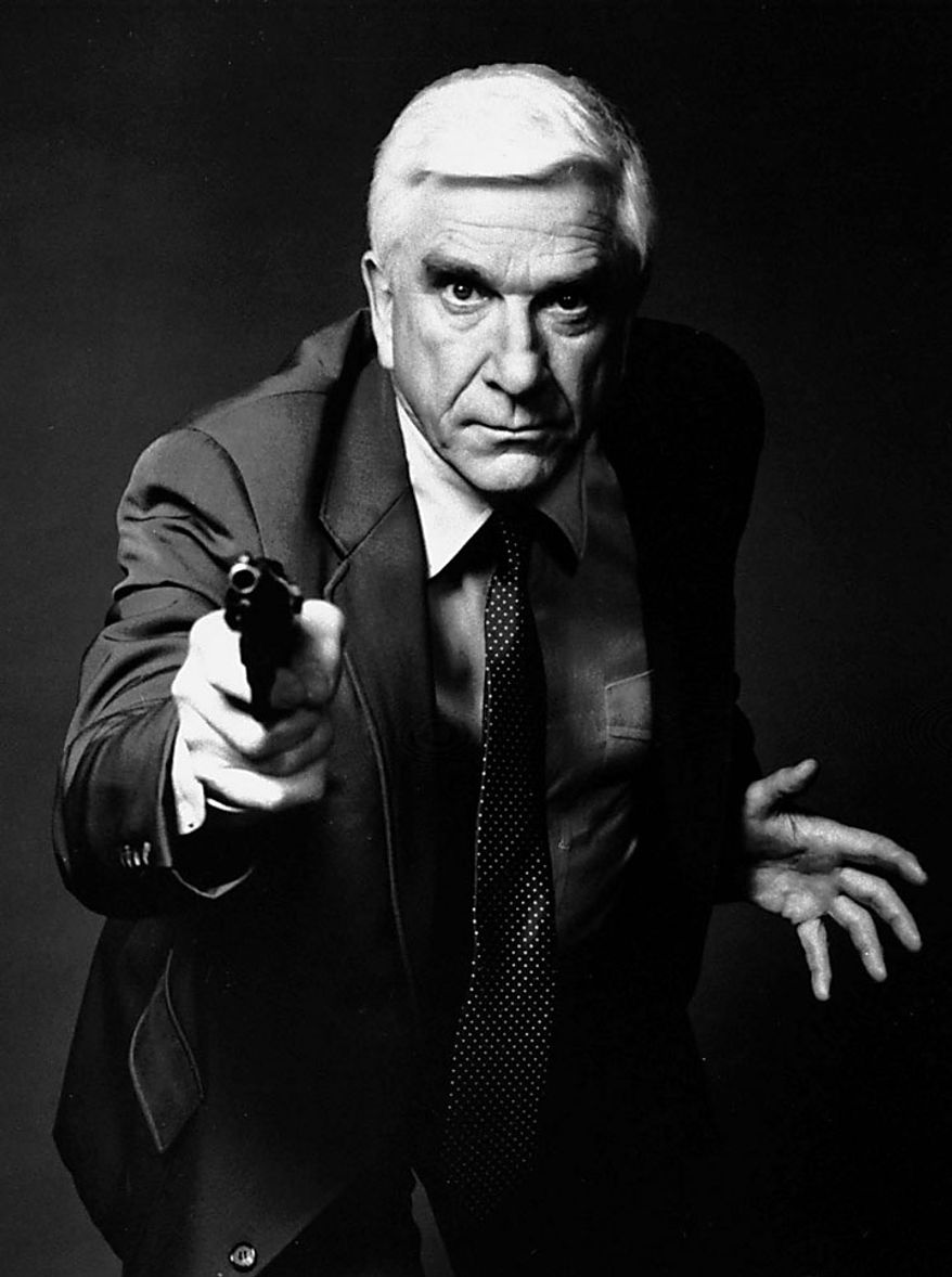 This 1988 file photo provided by Paramount, shows actor Leslie Nielsen as Lt. Frank Drebin in the movie "The Naked Gun: From the Files of Police Squad!" The Canadian-born Nielsen, who went from drama to inspired bumbling as a hapless doctor in "Airplane!" and the accident-prone detective Frank Drebin in "The Naked Gun" comedies, has died. He was 84. His agent John S. Kelly said the actor died Sunday, Nov. 28, 2010, at a hospital near his home in Florida where he was being treated for pneumonia. (AP Photo/Paramount, File)