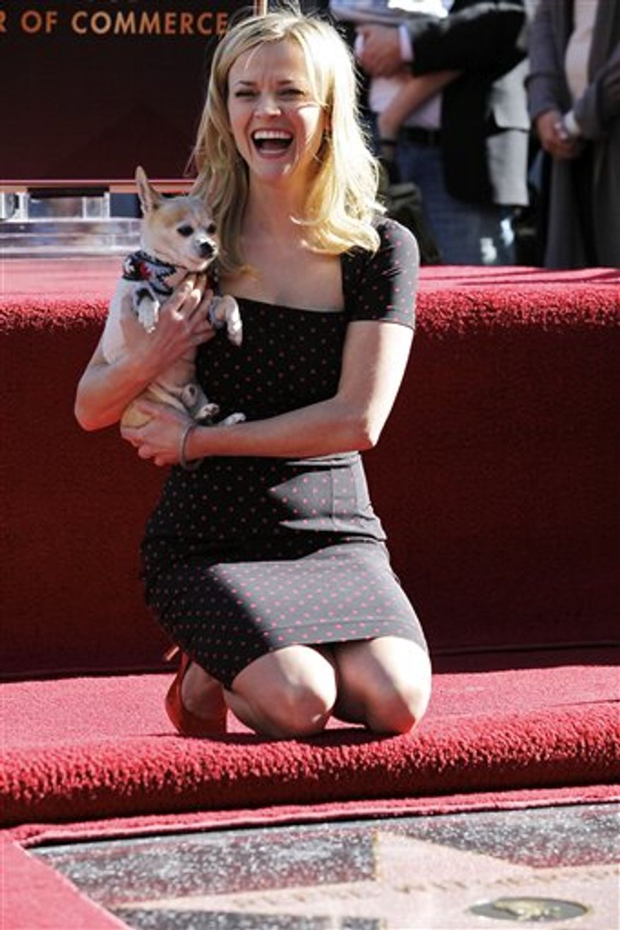 FILE - In this April 3, 2011 file photo, Robert Pattinson and Reese Witherspoon are seen at the 46th Annual Academy of Country Music Awards in Las Vegas. (AP Photo/Julie Jacobson)