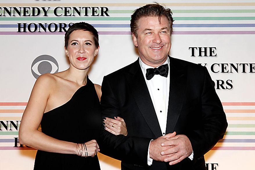 Alec Baldwin and Johanna Cox walk the red carpet at the Kennedy Center Honors in Washington on Sunday, Dec. 5, 2010. The 2010 honorees were Merle Haggard, Jerry Herman, Bill T. Jones, Paul McCartney and Oprah Winfrey. (AP Photo/Jacquelyn Martin)