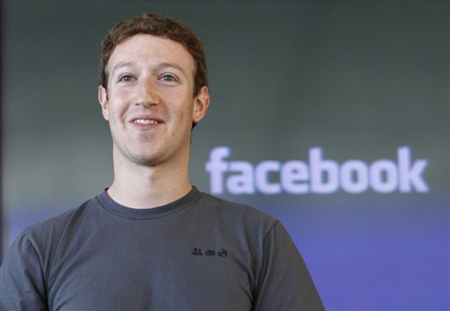 FILE - In this Nov. 15, 2010 file photo shows Facebook CEO Mark Zuckerberg smiling at an announcement in San Francisco. Another 17 of America's richest people, including Zuckerberg, junk bond pioneer Michael Milken and AOL co-founder Steve Case, have pledged to give away most of their wealth. They are the latest to join the Giving Pledge, an effort led by Microsoft founder Bill Gates and investor Warren Buffett to commit the country's wealthiest people to step up their charitable donations. (AP Photo/Paul Sakuma, file)
