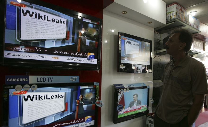 **FILE** A man watches Wikileaks memos at an electronic shop in Karachi, Pakistan on Dec. 2. (Associated Press)