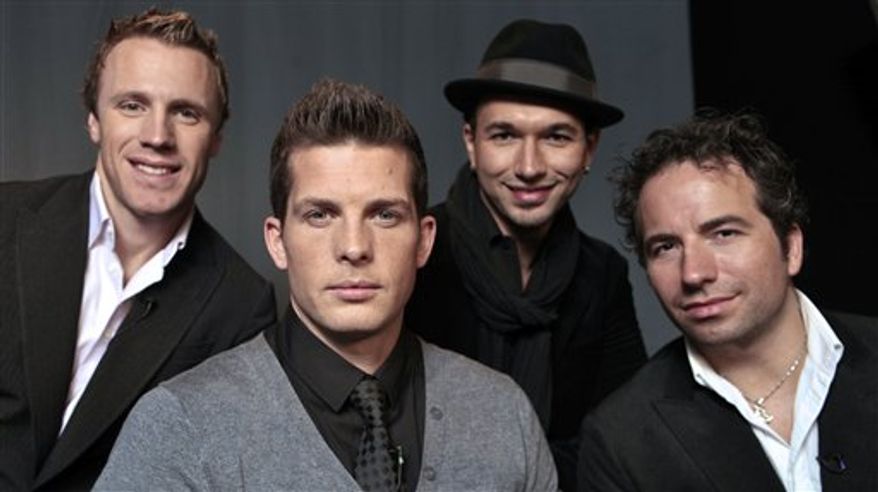 In this Oct. 8, 2010 photo, the Canadian Tenors, from left, Fraser Walters, Clifton Murray, Victor Micallef and Remigio Pereira pose for a photo in Los Angeles. (AP Photo/Damian Dovarganes)