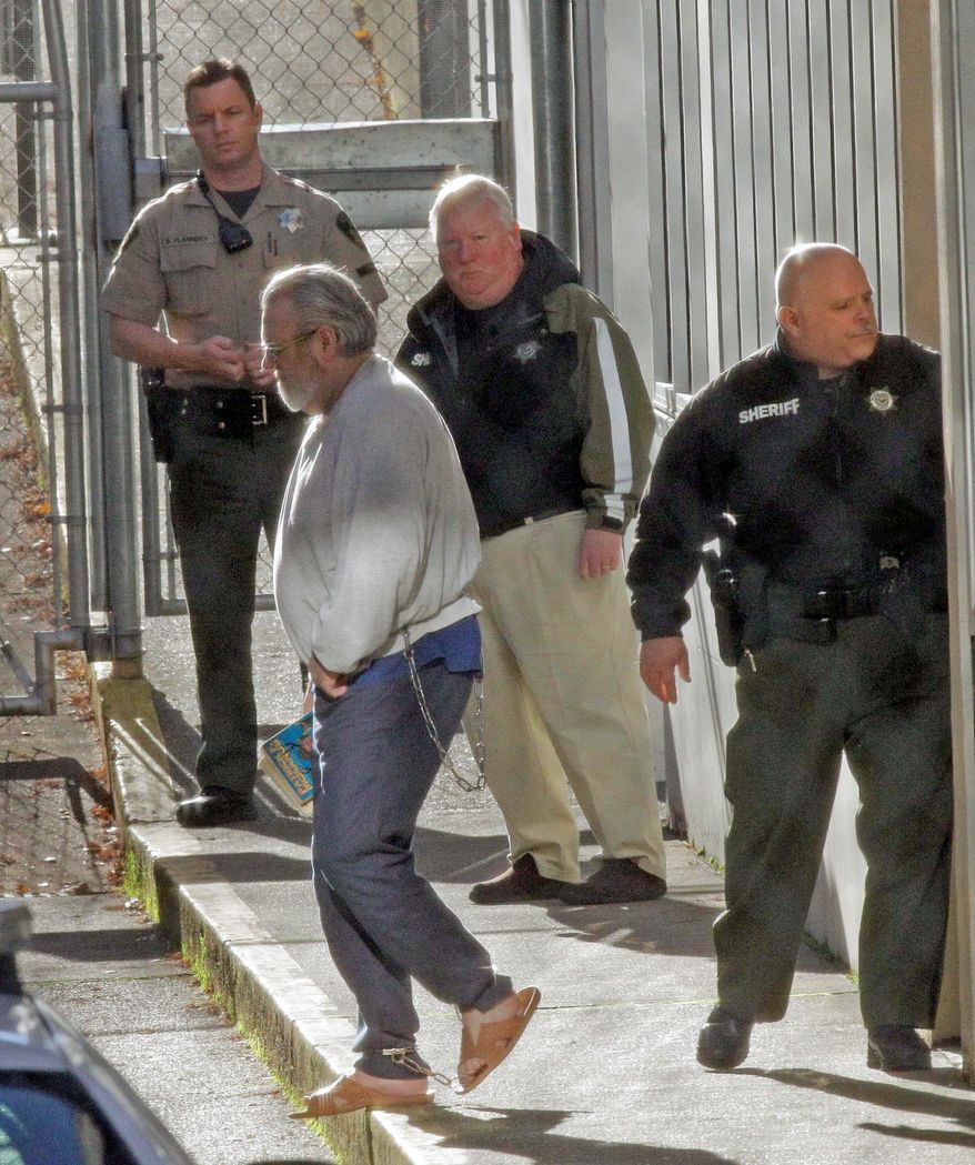ASSOCIATED PRESS PHOTOGRAPHS
Bruce Turnidge is led away in chains after a jury decided the fate of the convicted bank bombers at the Marion County Circuit Court on Wednesday in Salem, Ore. He was called "a murderer with no remorse."