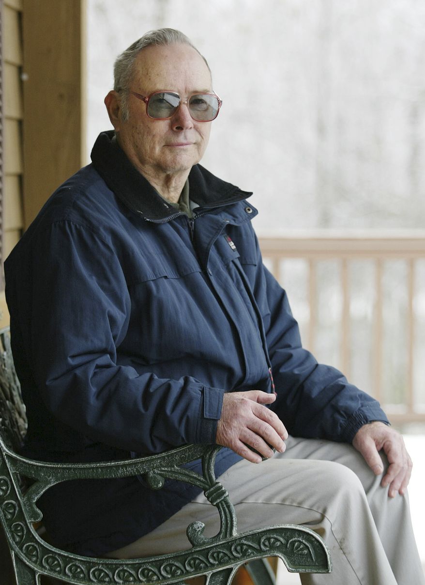In this Dec. 13, 2004, file photo, Ronald Herrick poses for a photograph at his home in Belgrade, Maine. Mr. Herrick made medical history when he donated one of his kidneys to his twin brother Richard 56 years ago in what's recognized as the world's first successful organ transplant. Richard lived eight years after receiving the transplant. Ronald died Monday, Dec. 27, 2010, in Augusta, Maine. He was 79. (AP Photo/Joel Page, File)