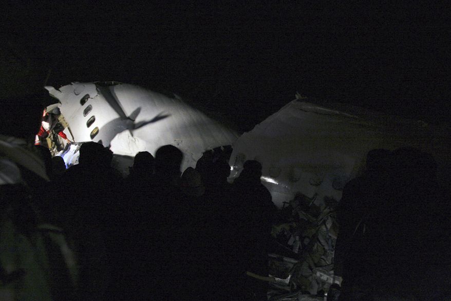 In this picture released by the Mehr news agency, wreckage of the IranAir Boeing 727 passenger plane is seen, which crashed Sunday after it was making an emergency landing, outside the city of Orumiyeh, 460 miles northwest of Tehran. An IranAir passenger jet carrying 106 people crashed as it was making an emergency landing Sunday in a snowstorm in the country's northwest and broke into several pieces, killing more than 70 of those on board, Iranian media reported. The others survived with light injuries. (Associated Press/Mehr News Agency, Esfandiar Asgharkhani)