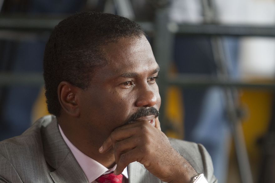 In this photo taken Dec. 3, 2010, Jude Celestin, one of Haiti's 19 presidential candidates, waits for the start of the Provisional Electoral Council meeting in capital Port-au-Prince. An Organization of American States international monitoring team will recommend on Monday, Jan. 10, 2011, to President Rene Preval that Mr. Celestin, a government-backed candidate, be eliminated from a presidential runoff election in favor of Michel Martelly, a popular musician who finished a close third in the contested official results. (AP Photo/Guillermo Arias)