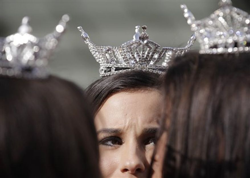 ** FILE ** Miss America contestants wait for the start of the "Show Us Your Shoes" parade on Friday, Jan. 14, 2011, in Las Vegas. (AP Photo/Julie Jacobson)