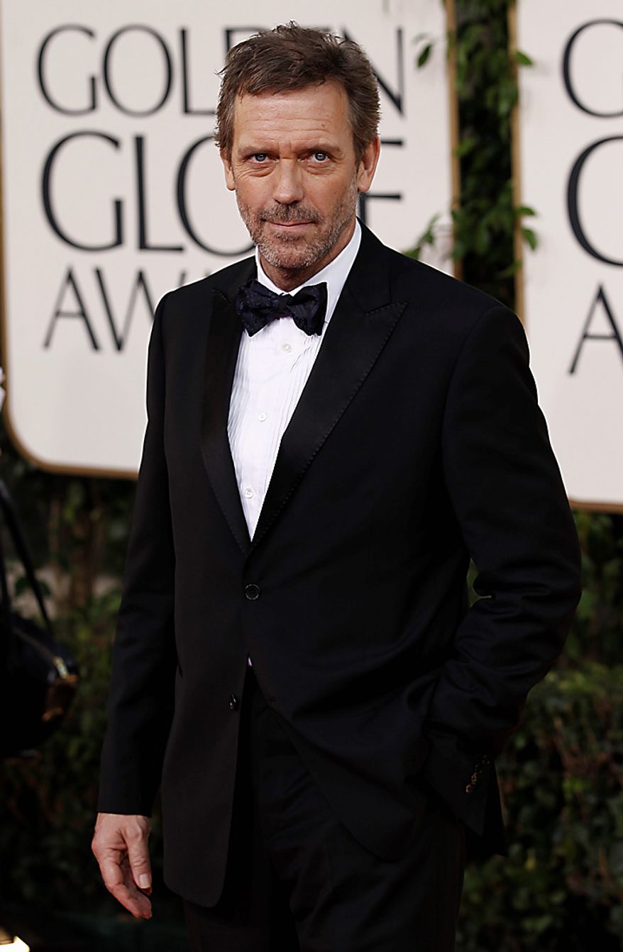 Hugh Laurie arrives for the Golden Globe Awards Sunday, Jan. 16, 2011, in Beverly Hills, Calif. (AP Photo/Matt Sayles)