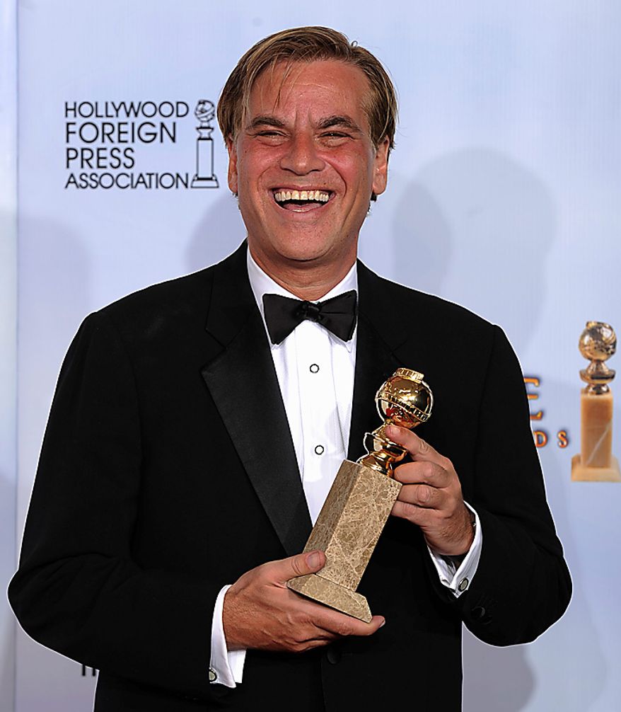 Aaron Sorkin holds the award he was given for Best Screenplay - Motion Picture for "The Social Network," at the Golden Globe Awards Sunday, Jan. 16, 2011, in Beverly Hills, Calif. (AP Photo/Matt J. Terrill)