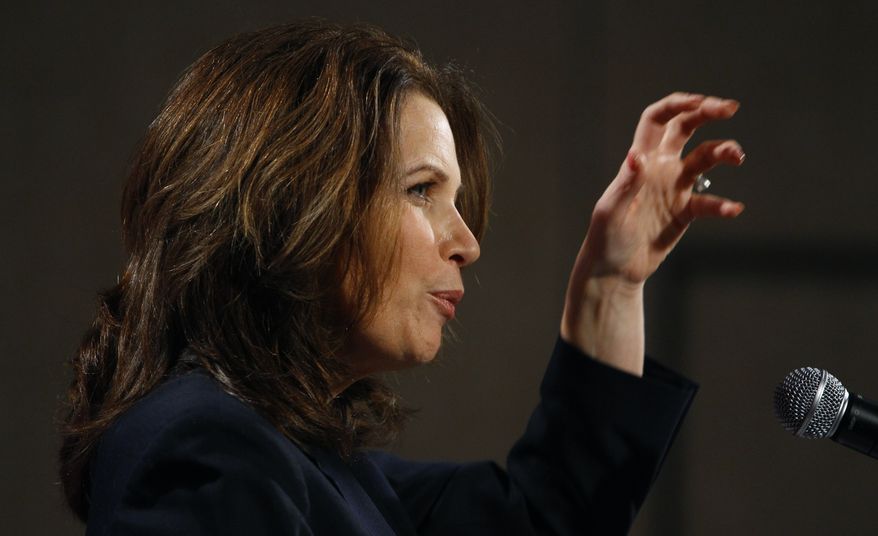 Rep. Michele Bachmann, Minnesota Republican, speaks Friday at a reception by the Iowans for Tax Relief in Des Moines, Iowa. (Associated Press)