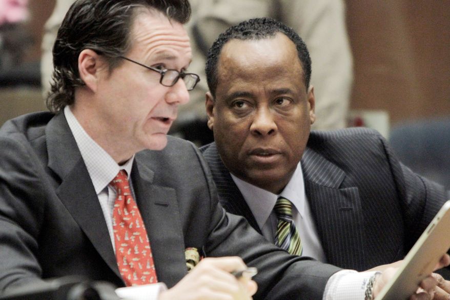 Conrad Murray (right), Michael Jackson's physician, and attorney Edward M. Chernoff appear in Los Angeles court Tuesday. The doctor pleaded "not guilty" to involuntary manslaughter in the pop star's June 2009 death. (Associated Press)