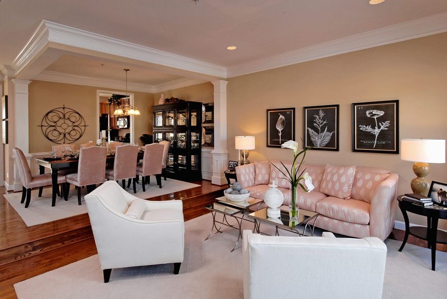 The Stratford model at East Gate features a dining room open to the living room toward the back of the home. The dining room is connected to the center-island kitchen.