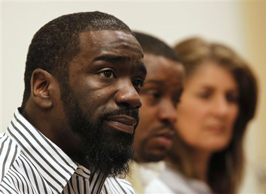 Baltimore Ravens player Ed Reed speaks at a news conference about the apparent recovery of his brother's body from the Mississippi River, at the St. Charles Parish Sheriff headquarters in Luling, La., Wednesday, Jan. 26, 2011. Authorities say a body recovered late Tuesday from the Mississippi River has been tentatively identified as Brian Reed. Background is Reed's brother, Wendell Sanchez, and family friend Jeanne Hall. (AP Photo/Gerald Herbert)