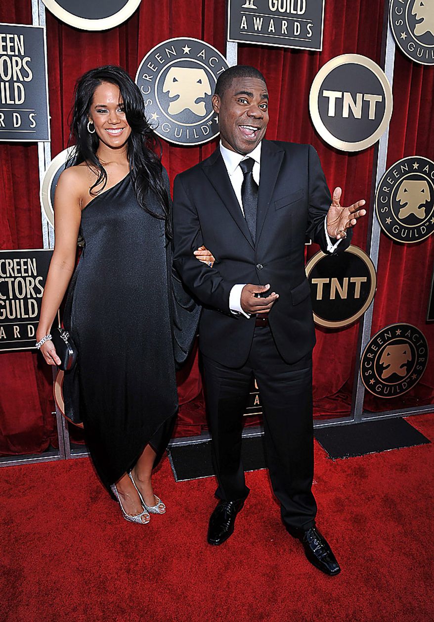Tracy Morgan, right, and a guest arrive at the 17th Annual Screen Actors Guild Awards on Sunday, Jan. 30, 2011, in Los Angeles. (AP Photo/Matt Sayles)