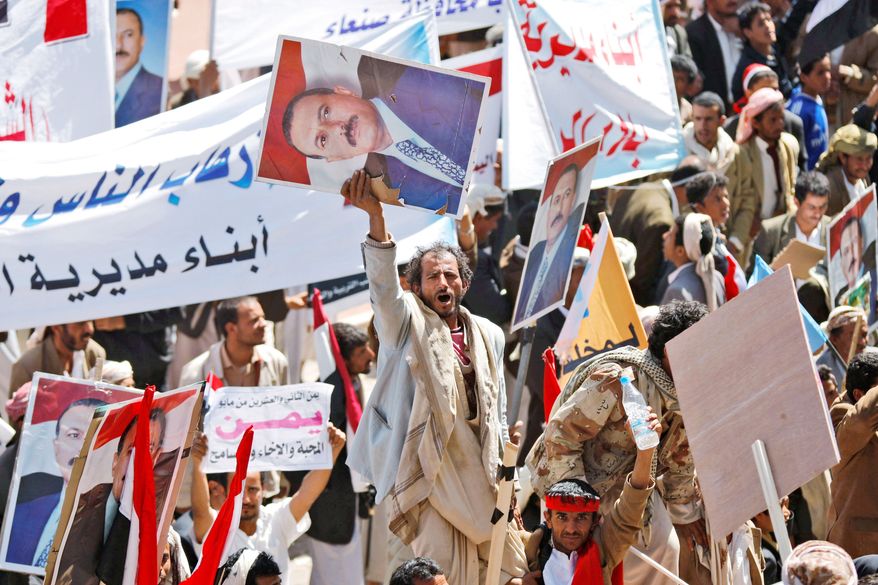 Supporters of Yemeni President Ali Abdullah Saleh, in power since 1978, rally in Sanaa on Wednesday. He told parliament Wednesday that he will not seek another term or turn over power to his son. (Associated Press)