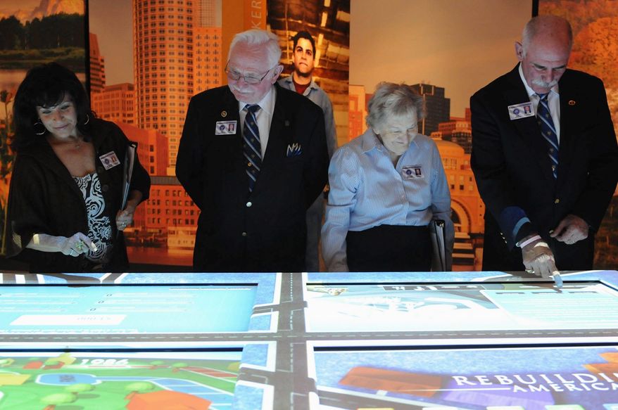 Docents at the Ronald Reagan Library and Museum in Simi Valley, Calif., try out a new multimedia exhibit, part of a $15 million renovation and enlargement. (Garrett Cheen/Special to The Washington Times)