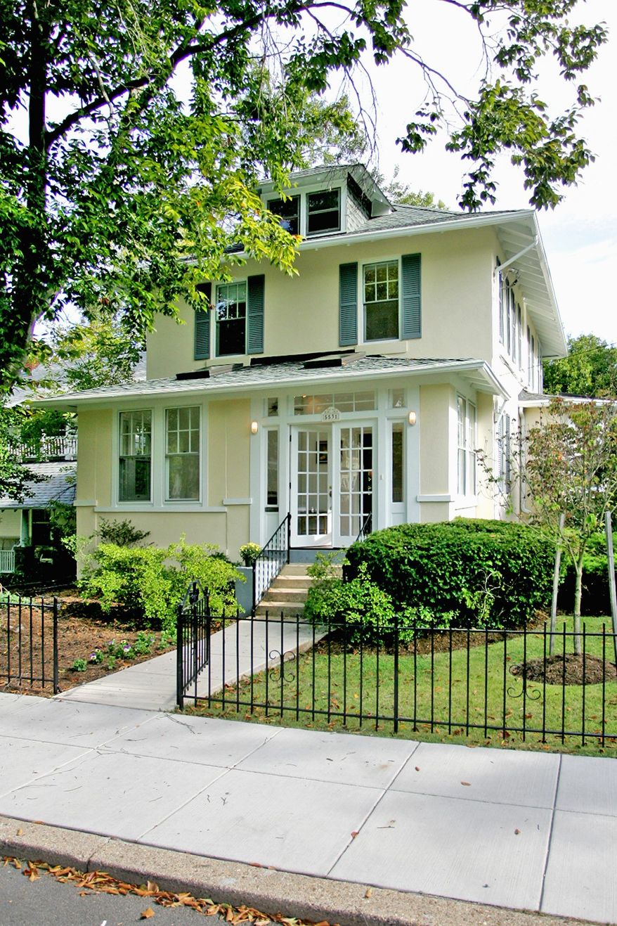 The farmhouse-style home at 5531 Sherier Place NW in the Palisades neighborhood is on the market for $989,000. The three-bedroom home has an enclosed porch with a ceiling fan and skylights.