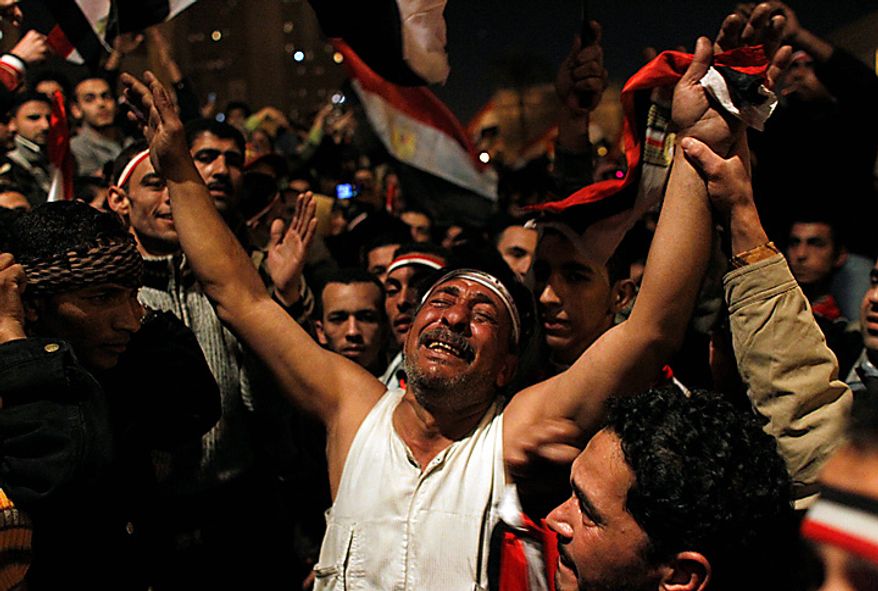 Anti-government protesters celebrate in Tahrir Square in downtown Cairo, Egypt, Thursday, Feb. 10, 2011. Egypt's military announced on national television it had stepped in to secure the country and promised protesters calling for President Hosni Mubarak's ouster that all their demands would soon be met. Tens of thousands of protesters packed in central Tahrir broke into chants of "We're almost there, we're almost there" and waved V-for-victory signs as thousands more flowed in to join them well after nightfall. (AP Photo/Tara Todras-Whitehill)