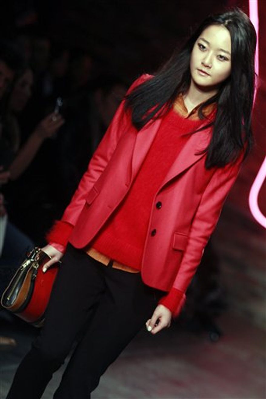 Fashion from the Fall 2011 collection of Donna Karan's DKNY is modeled on Sunday, Feb. 13, 2011 in New York. (AP Photo/Bebeto Matthews)