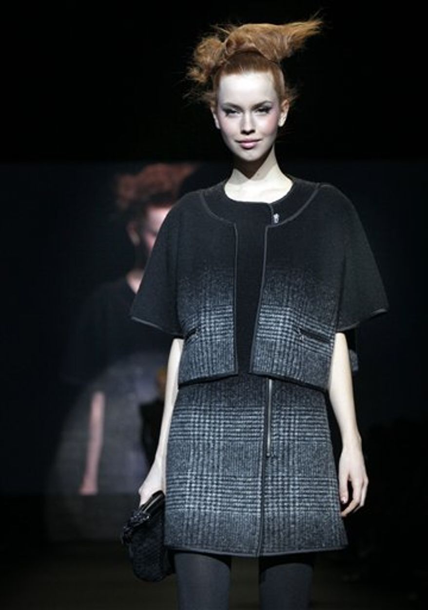 The fall 2011 collection of designer Vivienne Tam is modeled during Fashion Week in New York, Saturday, Feb. 12, 2011. (AP Photo/Richard Drew)