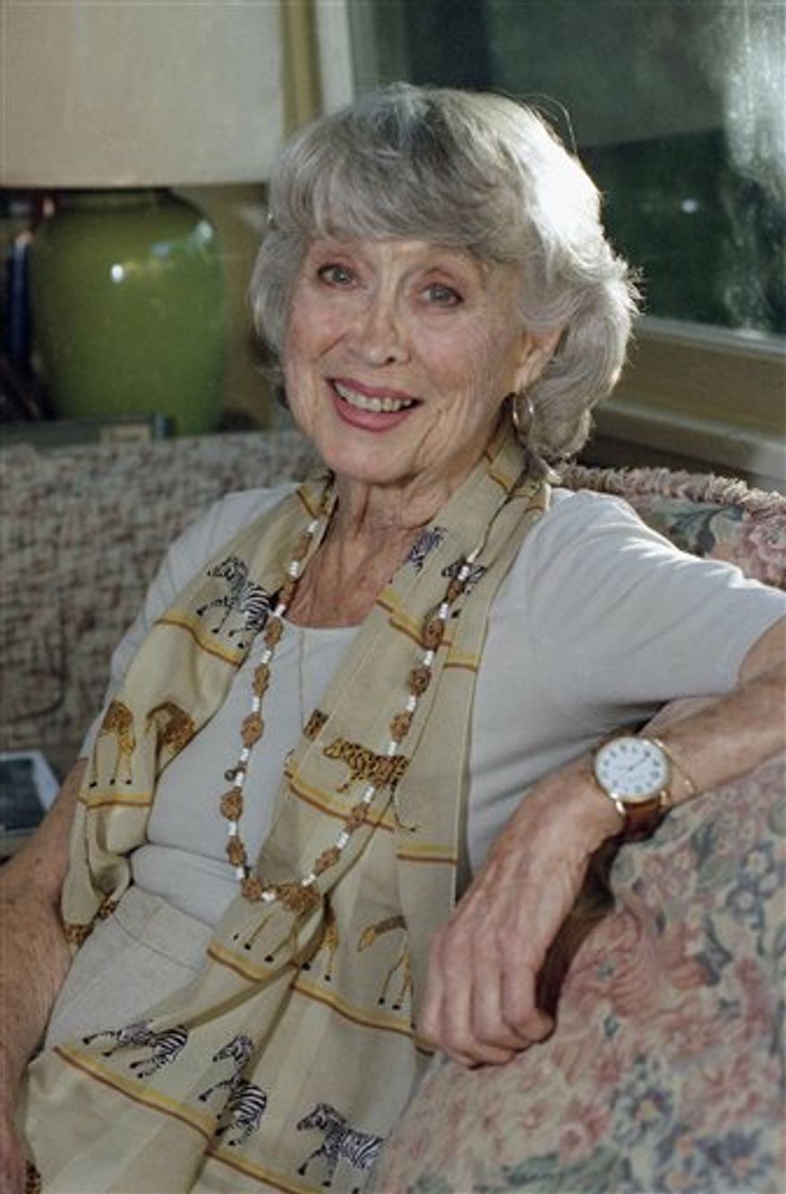 FILE - Actress Betty Garrett poses at her home in Los Angeles on in this Dec. 16, 1997 file photo. Garrett, who played Frank Sinatra's sweetheart in two MGM musicals before her career was hampered by the Hollywood blacklist, died Saturday Feb. 12, 2011 in Los Angeles. Later in life she became well-known to TV audiences with recurring roles in the 1970s sitcoms "All in the the Family" and Laverne and Shirley. She was 91. (AP Photo/Mark J. Terrill, File)