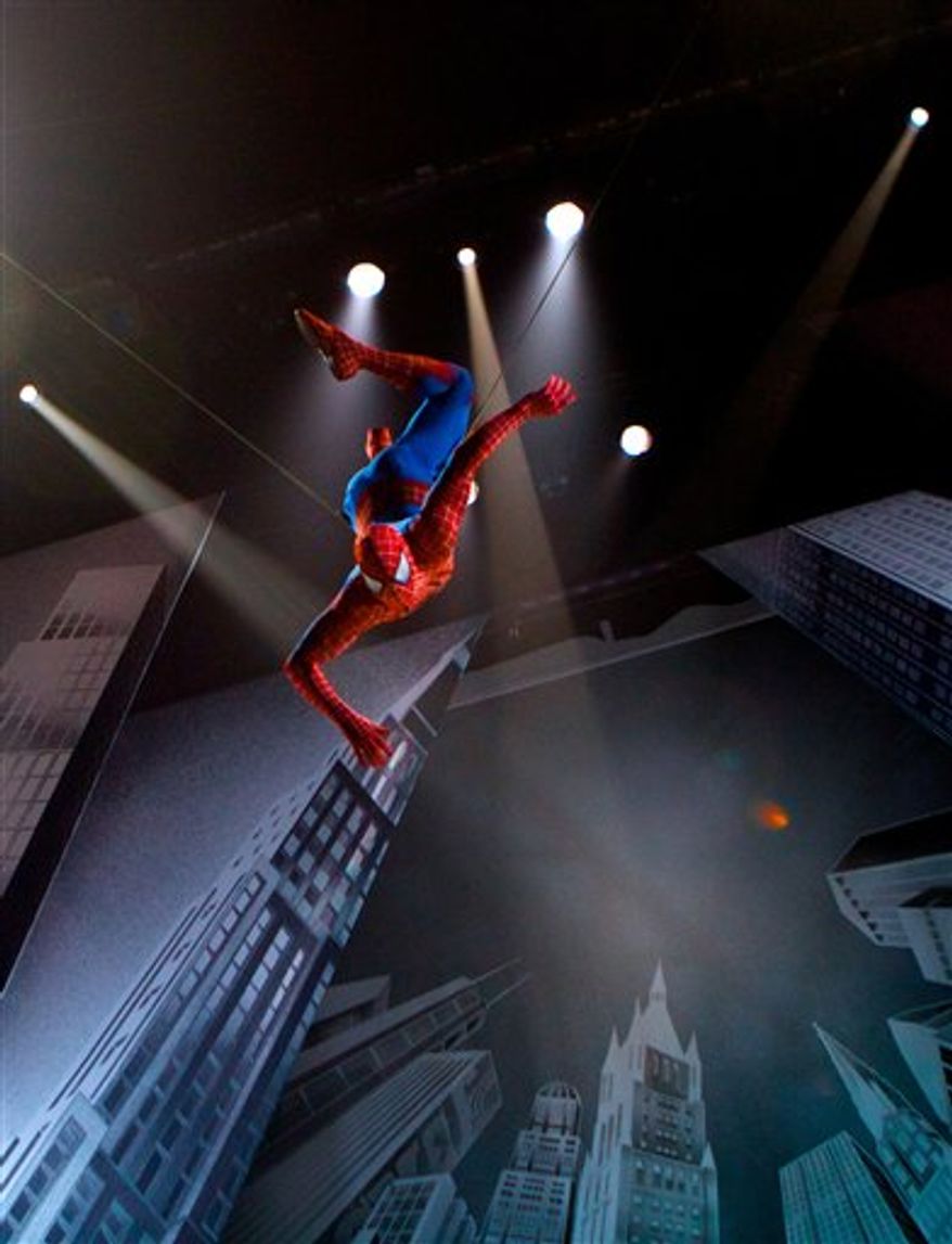 In this theater publicity image released by The O and M Co., Reeve Carney, center, portrays Peter Parker in a scene from the musical "Spider-Man: Turn Off the Dark," in New York. (AP Photo/The O and M Co., Jacob Cohl)