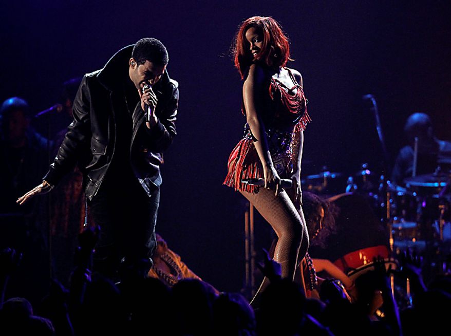 Drake, left, and Rihanna perform at the 53rd annual Grammy Awards on Sunday, Feb. 13, 2011, in Los Angeles. (AP Photo/Matt Sayles)