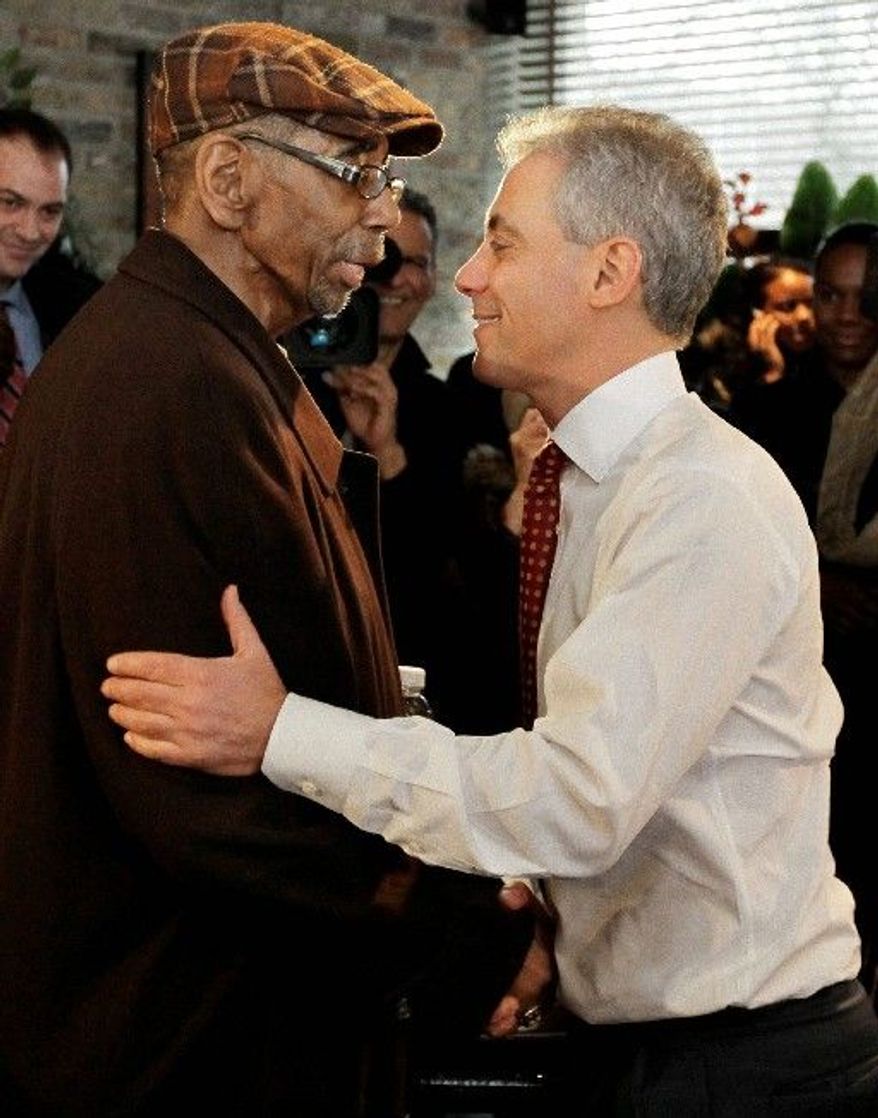 Chicago mayoral candidate Rahm Emanuel (right) is greeted by U.S. Rep. Bobby L. Rush as Mr. Emanuel arrives at Chicago's Home of Chicken and Waffles for lunch Monday. (Associated Press)