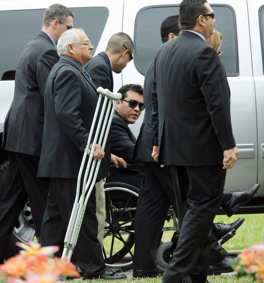 Agent Zapata's partner, Victor Avila, who was wounded in the leg, arrives at Rose Lawn Memorial Gardens in Brownsville. The agents were assigned to the attache office in Mexico City. (Associated Press)
