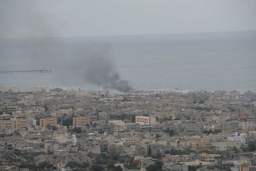 This photo released by China's Xinhua News Agency shows general view of the eastern Libyan town of Derna Wednesday, Feb. 23, 2011. (AP Photo/Xinhua, Nasser Nouri)
