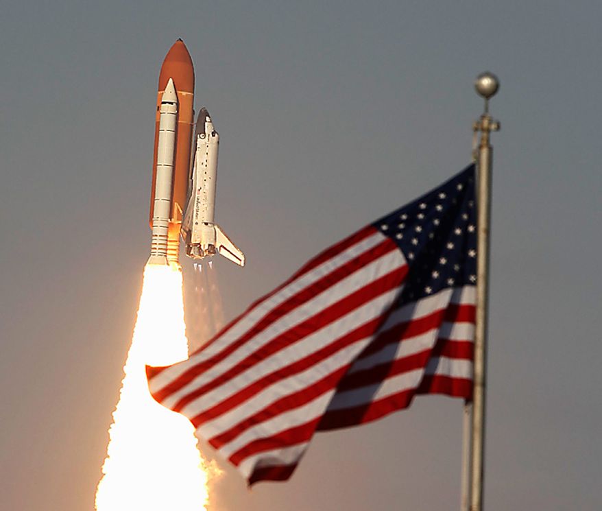 Space shuttle Discovery lifts off from Pad 39A at the Kennedy Space Center in Cape Canaveral, Fla., Thursday, Feb. 24, 2011. The crew of six astronauts are on an 11-day mission to the international space station. (AP Photo/Wilfredo Lee)
