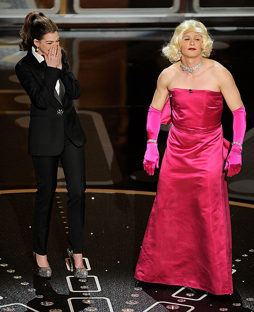 Show hosts Anne Hathaway, left, and James Franco are seen during the 83rd Academy Awards on Sunday, Feb. 27, 2011, in the Hollywood section of Los Angeles. (AP Photo/Mark J. Terrill)