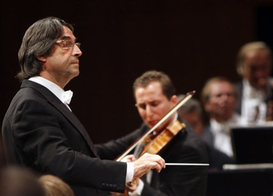 FILE - This Sept. 8, 2008 file photo shows Maestro Riccardo Muti leading the Vienna Philharmonics, in Lucerne, Switzerland. It isn't every day that a conductor concedes an encore for an opera chorus. Even rarer is asking the audience to sing it, but maestro Riccardo Muti has just done so for the love of homeland. Muti swirled about on his podium late Saturday, March 12, 2011 to face the audience during Giuseppe Verdi's "Nabucco'' at Rome's Teatro dell'Opera when shouts of "bis!'' (encore!) rang out. (AP Photo/Keystone, Sigi Tischler, file)
