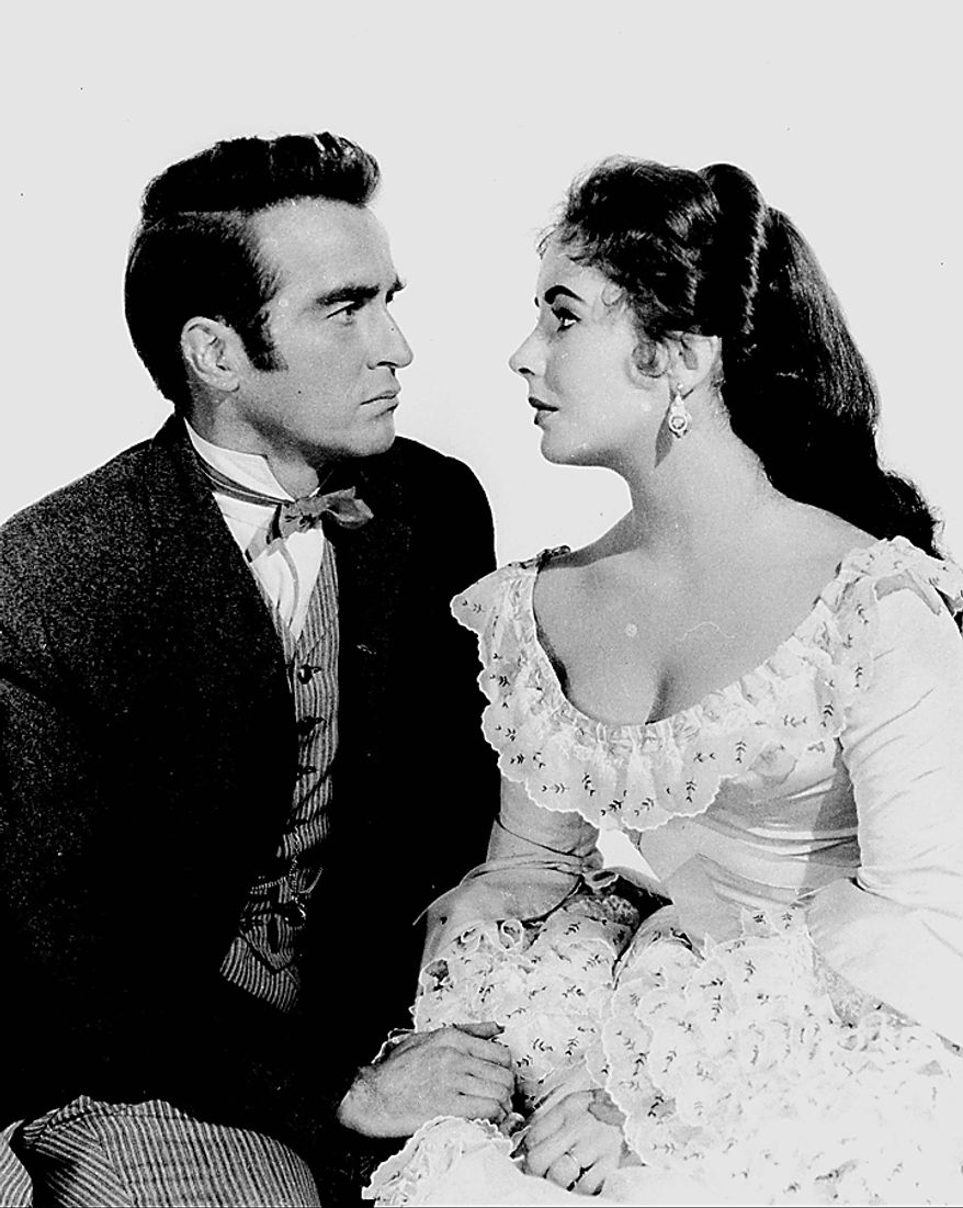 In this 1957 file photo, Elizabeth Taylor poses with Montgomery Clift for the film "Raintree County." Publicist Sally Morrison says Taylor died Wednesday, March 23, 2011 in Los Angeles of congestive heart failure at age 79. (AP Photo/File)