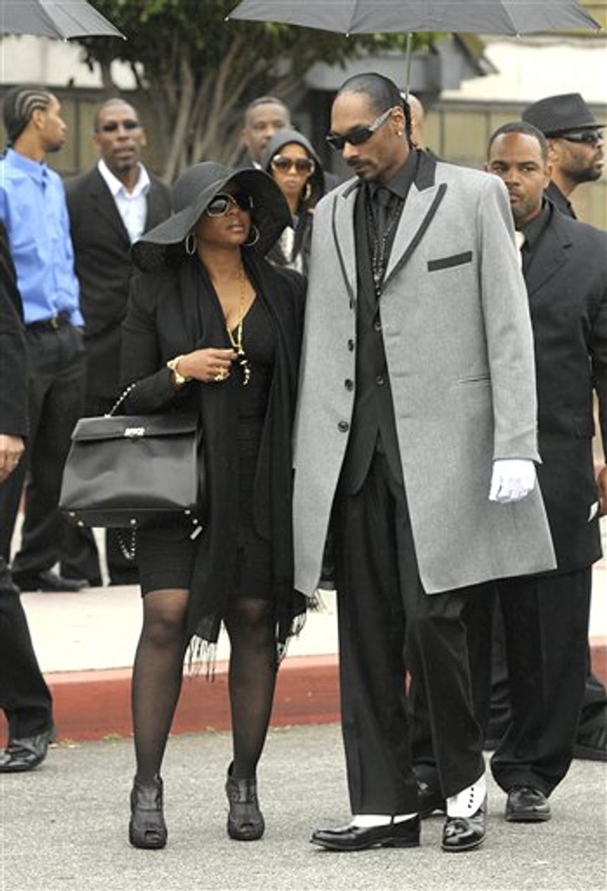 Rapper Game arrives at the memorial service for the late rapper Nate Dogg at the Queen Mary Dome in Long Beach, Calif. on Saturday, March 26, 2011. Nate Dogg, whose real name is Nathaniel Dwayne Hale, died on March 15th. (AP Photo/Dan Steinberg)