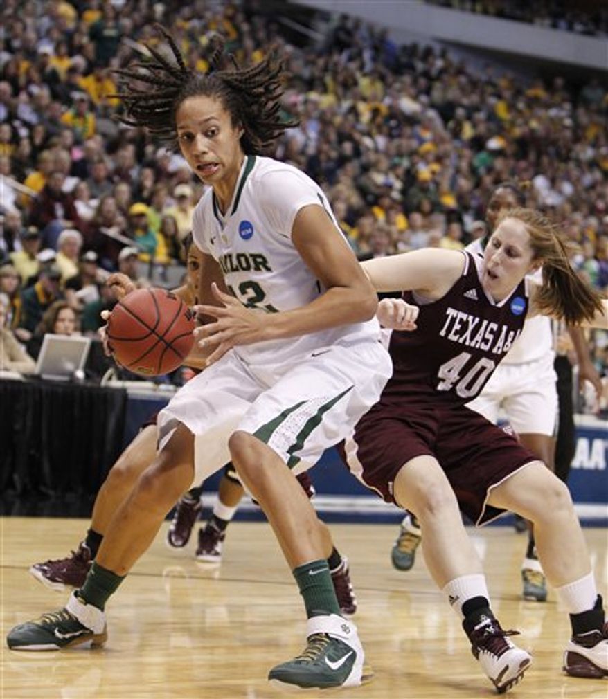 Baylor center Brittney Griner (42) is defended by Texas A&M forward Kelsey Assarian (40) during the first half of an NCAA women's college basketball tournament regional final, Tuesday, March 29, 2011, in Dallas. (AP Photo/LM Otero)