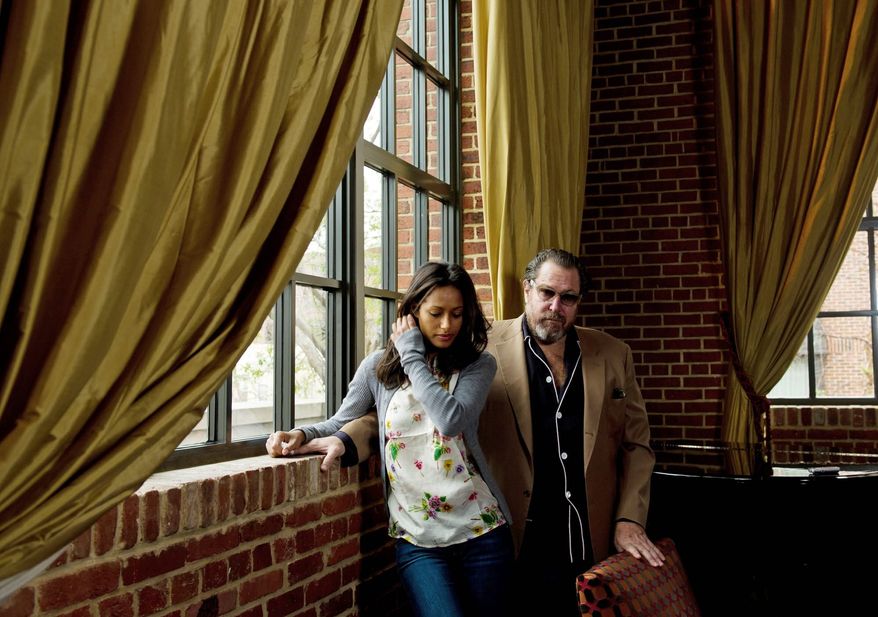 Director Julian Schnabel, with Rula Jebreal, says the controversy over "Miral" has been "spectacular for the movie." (Rod Lamkey Jr./The Washington Times)