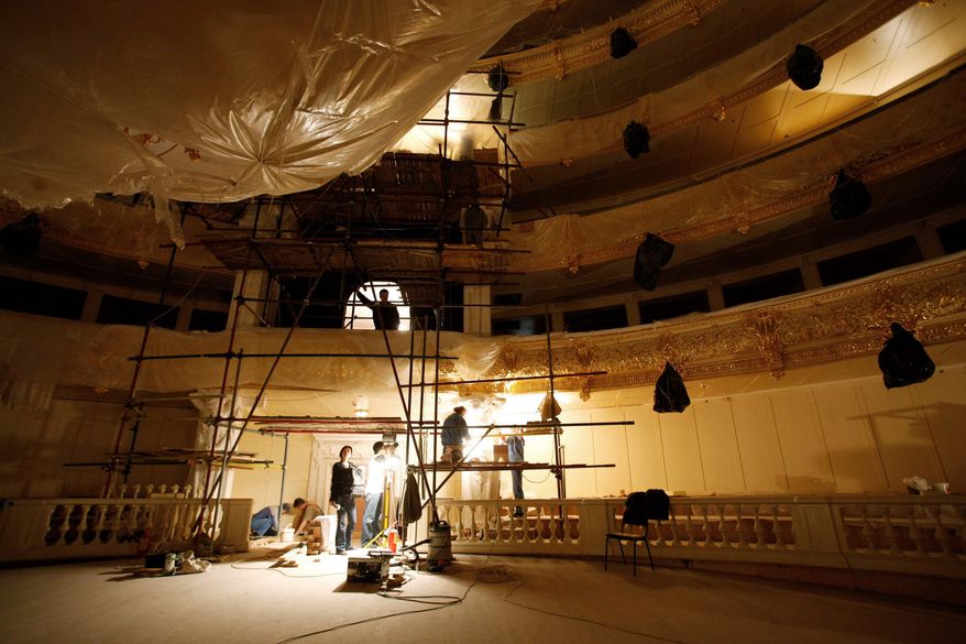 Workers restore 19th-century ornaments to the walls inside the building of the Bolshoi Theater in Moscow. Russia's iconic theater has been closed for reconstruction since 2005, spawning accusations of embezzlement and fraud. (Associated Press)