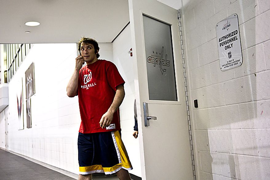 Capitals player Alex Ovechkin emerges from the locker room on his way to talk with the media at the Kettler Ice Complex in Arlington on Thursday, May 5, 2011. (Drew Angerer/The Washington Times)