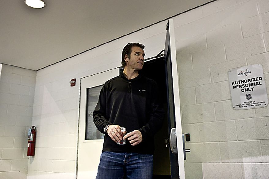 Capitals player Mike Knuble emerges from the locker room at the Kettler Ice Complex in Arlington on his way to talk to the media on Thursday, May 5, 2011. (Drew Angerer/The Washington Times)