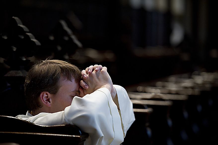 Brother Philip Neri Reese prays in the chapel at the Dominican House of Studies in Washington on Tuesday, May 24, 2011, before he and 13 other Catholic friars from the Dominican order made a pilgrimage from the studies house in Northeast to St. Dominic's Parish in Southwest. This is the first time the friars have held the pilgrimage, which commemorated the date that St. Dominic's body was moved from its original grave to its current resting place in Bologna, Italy. Each of the friars was instructed to have a personal intention for the pilgrimage. (Barbara L. Salisbury/The Washington Times)