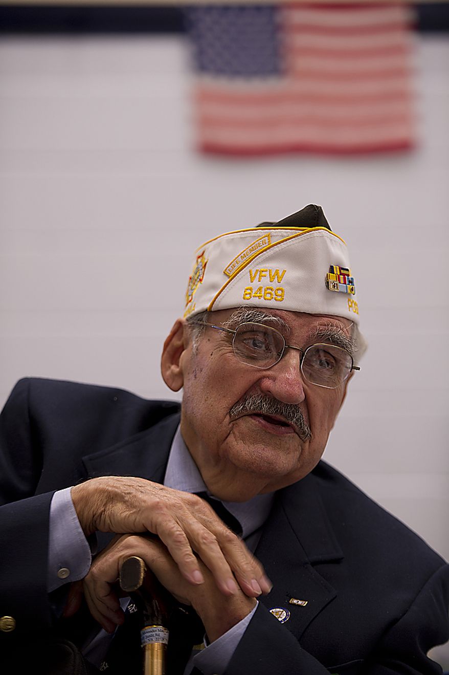 Sandy MacNabb of Oakton, Va., takes a break in the "canteen" at Rocky Run Middle School in Chantilly, Va., during the school's annual World War II Day, called "The Latest Generation Meets the Greatest Generation," on Thursday, June 9, 2011. The day included small-group interviews with WWII vets as well as panel discussions and World War II-inspired entertainment provided by the students. More than 100 vets participated. MacNabb served in the U.S. Navy in Korea, China and the Formosa Straits. (Barbara L. Salisbury/The Washington Times)