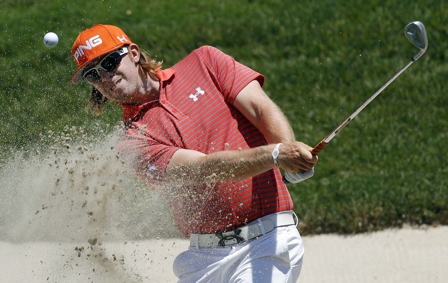 Hunter Mahan chips to the 11th green during a practice round for the U.S. Open Championship golf tournament in Bethesda, Md., Wednesday, June 15, 2011. (AP Photo/Matt Slocum)