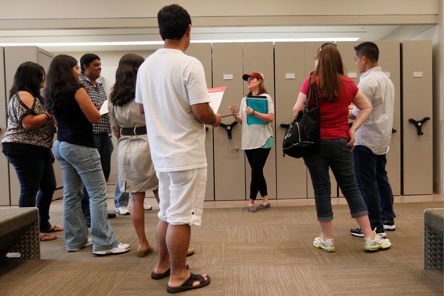 Watson Adventures host Liz Williams gives instructions at the start of the "Murder at the Met" scavenger hunt. Participants received a map, directions to specific galleries and 22 questions linked to 22 works of art.