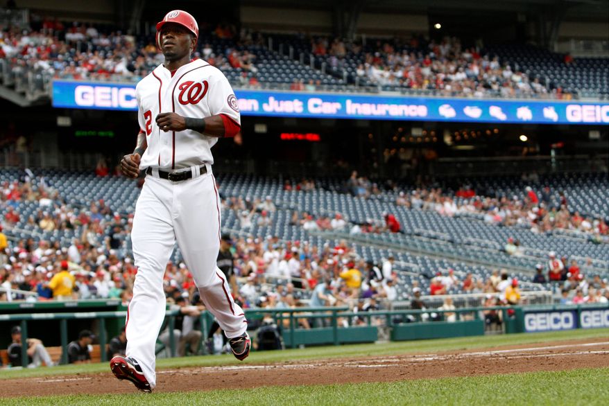 "He's still learning about himself as a hitter. ... But he definitely causes some problems when he gets on base," manager Davey Johnson says of Roger Bernadina, shown scoring against Colorado on July 8. (Associated Press)