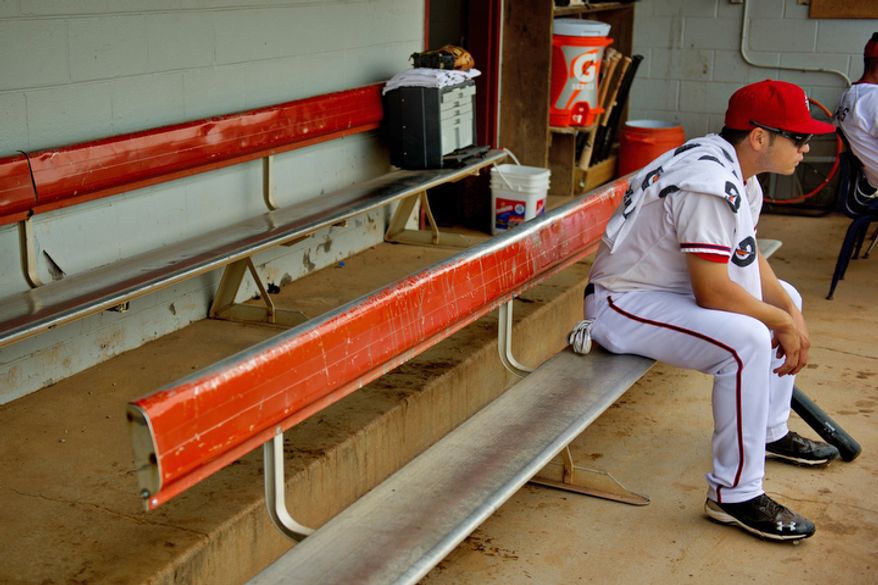 Potomac Nationals outfielder J.P. Ramirez sits in the small dugout at Pfitzner Stadium, prior to a game between the Potomac Nationals and Lynchburg Hillcats, in Woodbridge, Va., Tuesday, July 19, 2011. (Drew Angerer/The Washington Times)