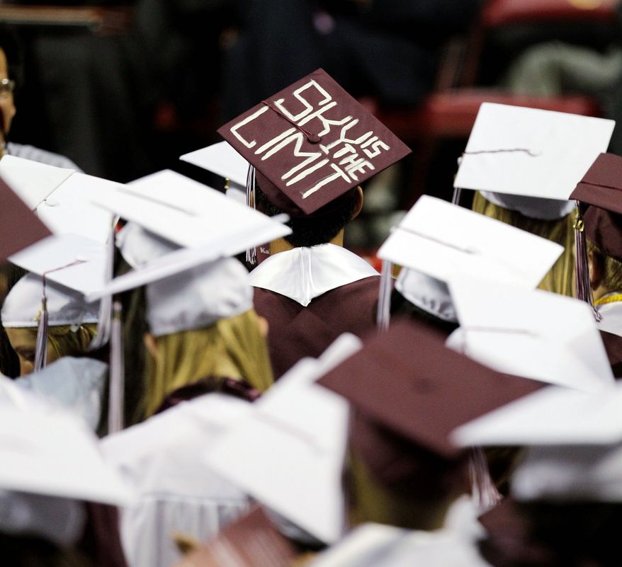 ** FILE ** Graduates listen to the commencement address at Kalamazoo Central High School in Kalamazoo, Mich., in June 2011. (Associated Press)