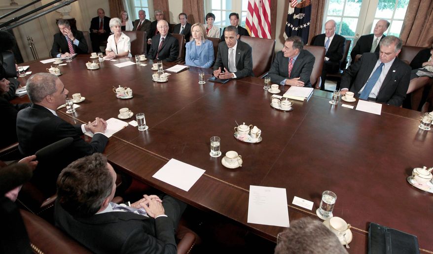 President Obama presides at a Cabinet meeting on Wednesday. In the background from left are Education Secretary Arne Duncan, Health and Human Services Secretary Kathleen Sebelius, Interior Secretary Kenneth L. Salazar, Secretary of State Hillary Rodham Clinton, the president, Defense Secretary Leon E. Panetta and Transportation Secretary Ray LaHood. In the foreground from left are, Labor Secretary Hilda L. Solis, Attorney General Eric H. Holder Jr. and Treasury Secretary Timothy F. Geithner. (Associated Press)