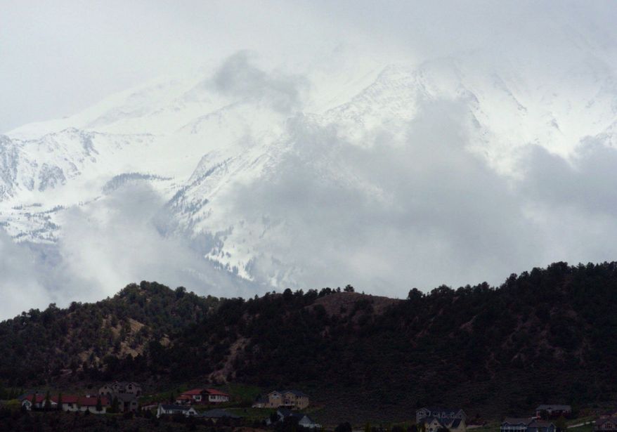 ASSOCIATED PRESS
John Denver wrote "Rocky Mountain High" while camping on the southern edge of Mount Sopris, seen here in 2004. Some say it's not legal to name a peak for him because it's in a wilderness area.