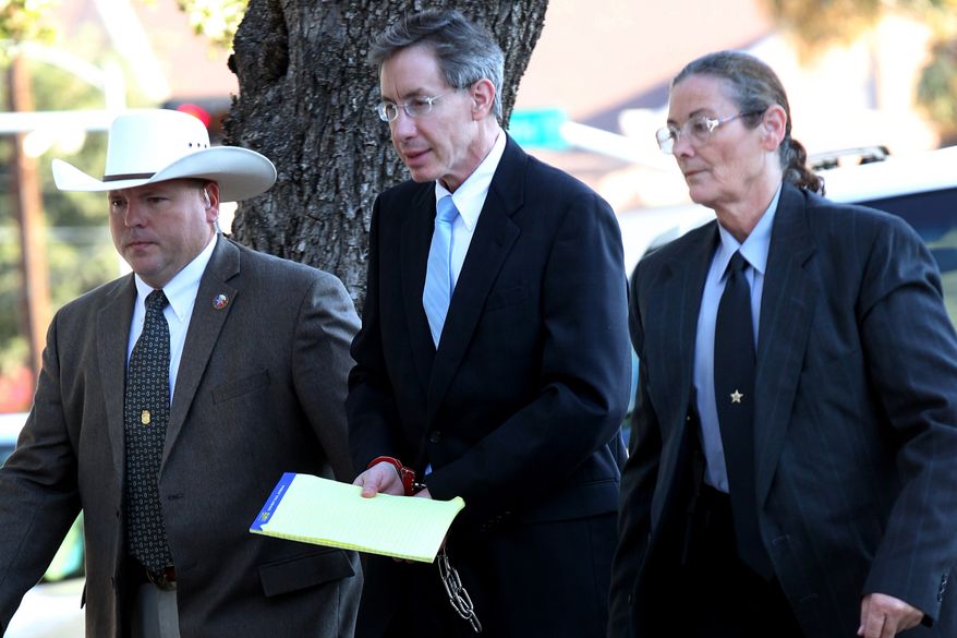 ** FILE ** Warren Jeffs (center) is taken into the side entrance of the Tom Green County Courthouse in San Angelo, Texas, on Monday, Aug. 8, 2011. (AP Photo/San Angelo Standard-Times)